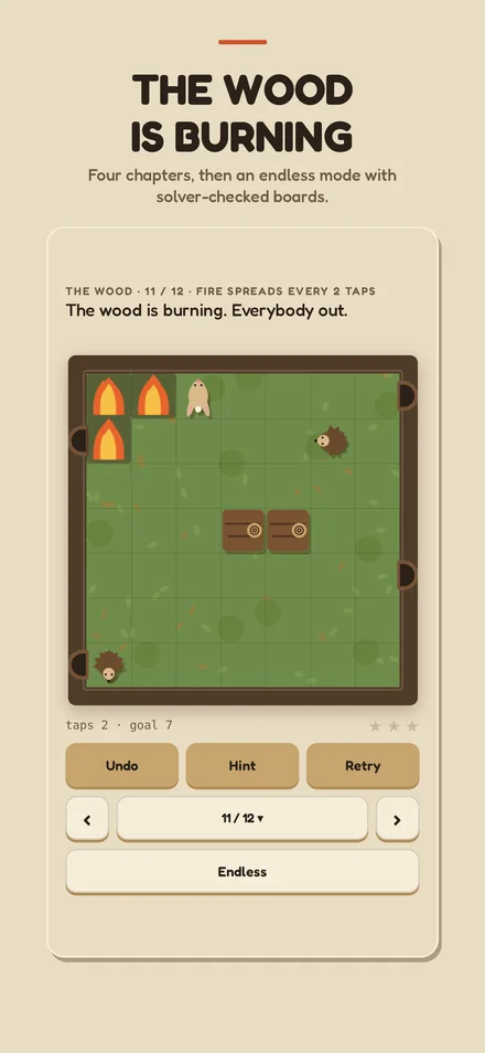 The wood, with a fire spreading across the board